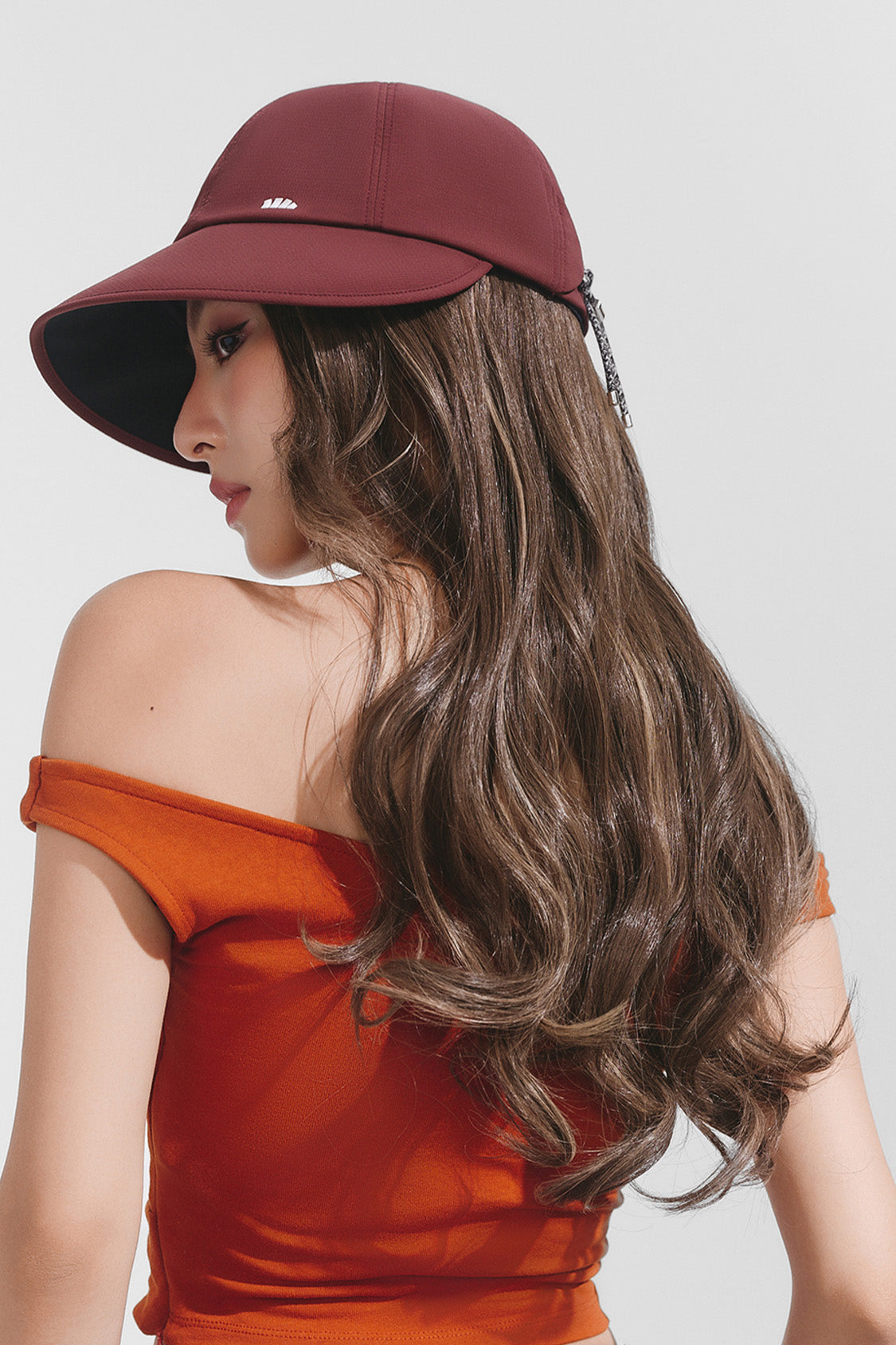 women's puffi-hair sun shield cap with 3d ventilation dome #color_crimson cap with toasted gold loose curls